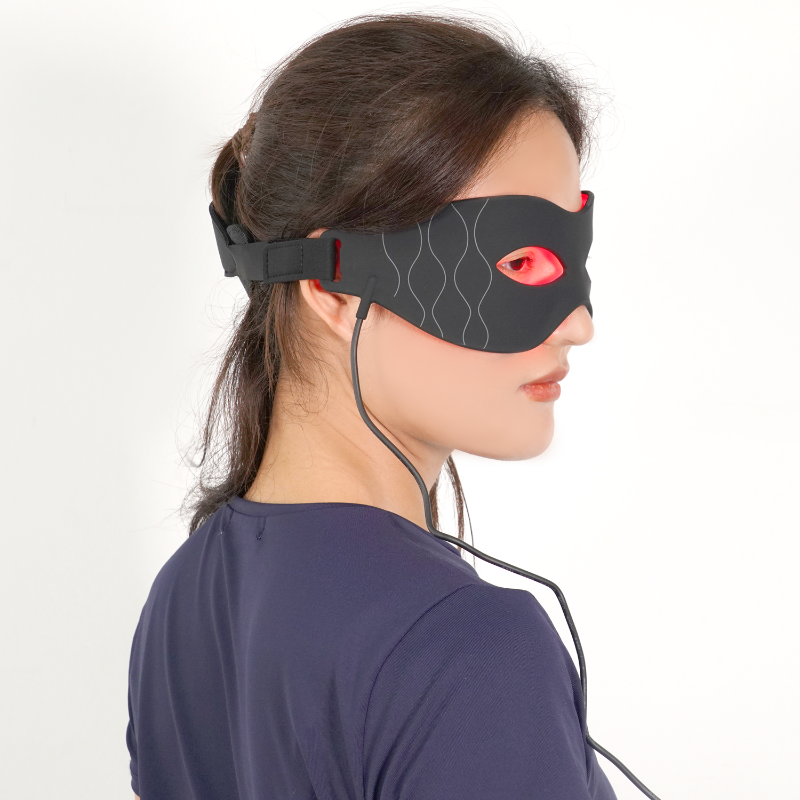 Woman wearing a red light therapy eye mask